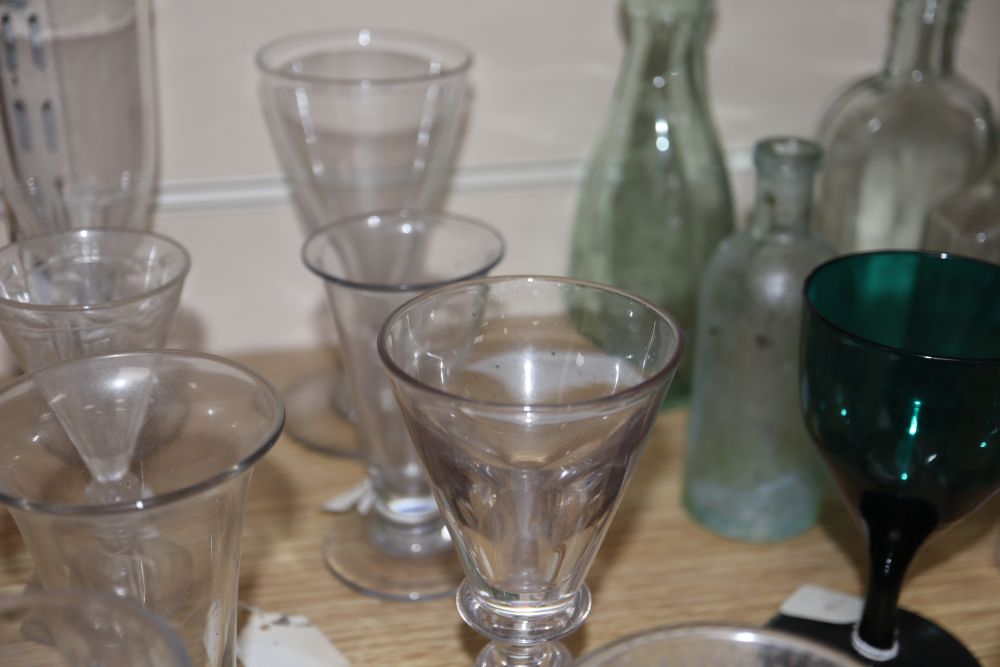 A quantity of glasses and glass bottles